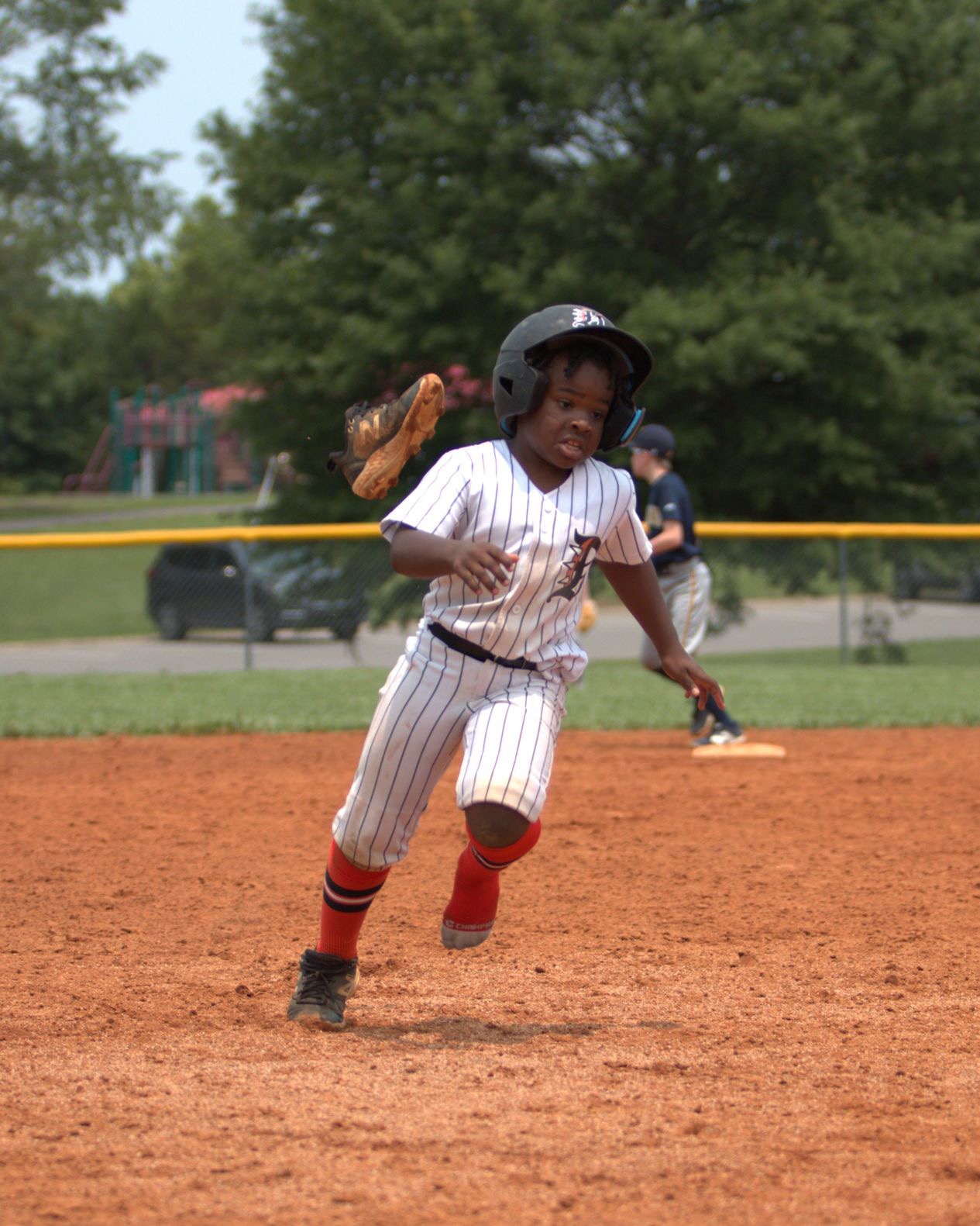 Dirt Dogs player running the bases